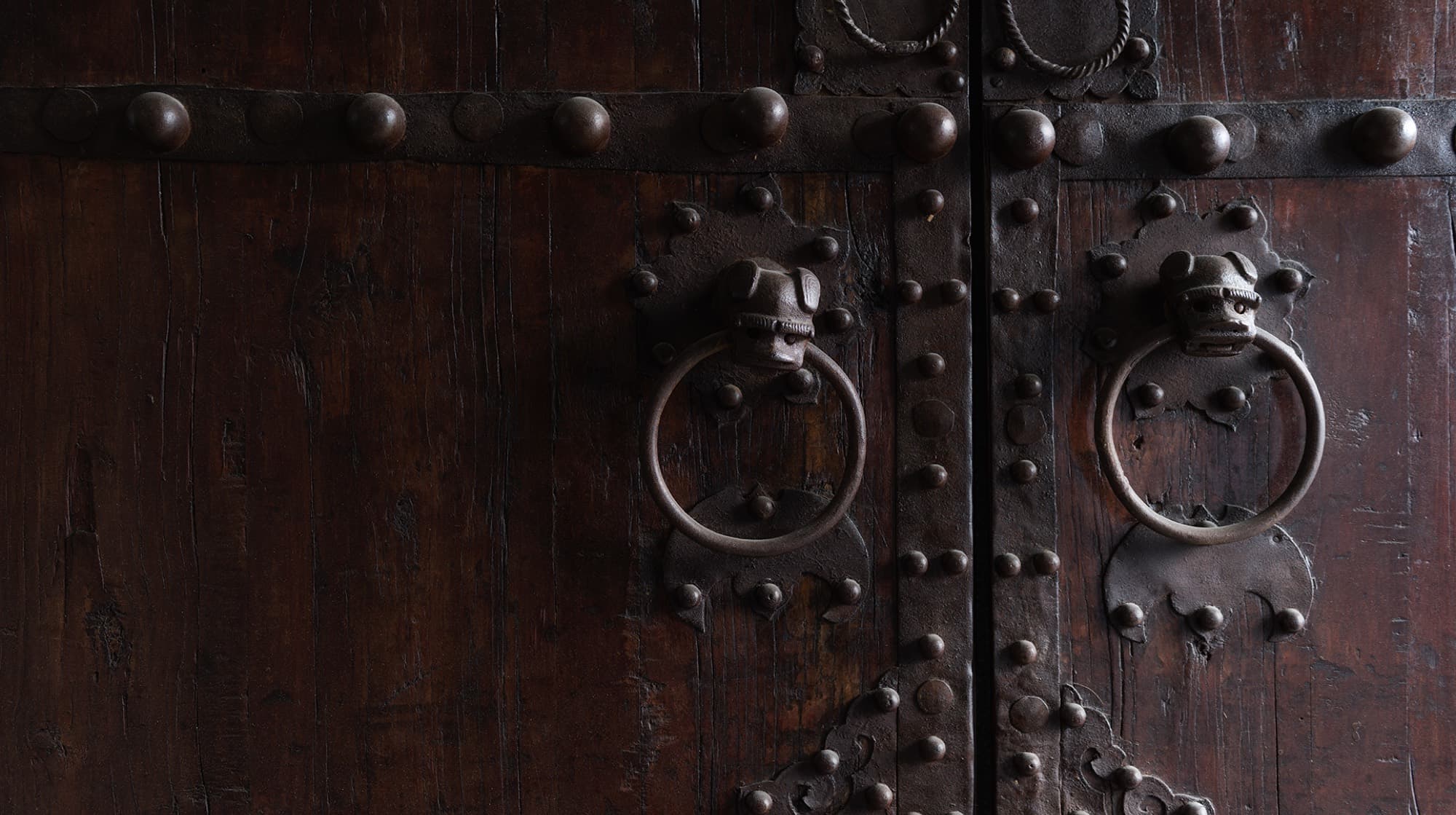 Carved Asian timber doors set into the cedar-lined interior