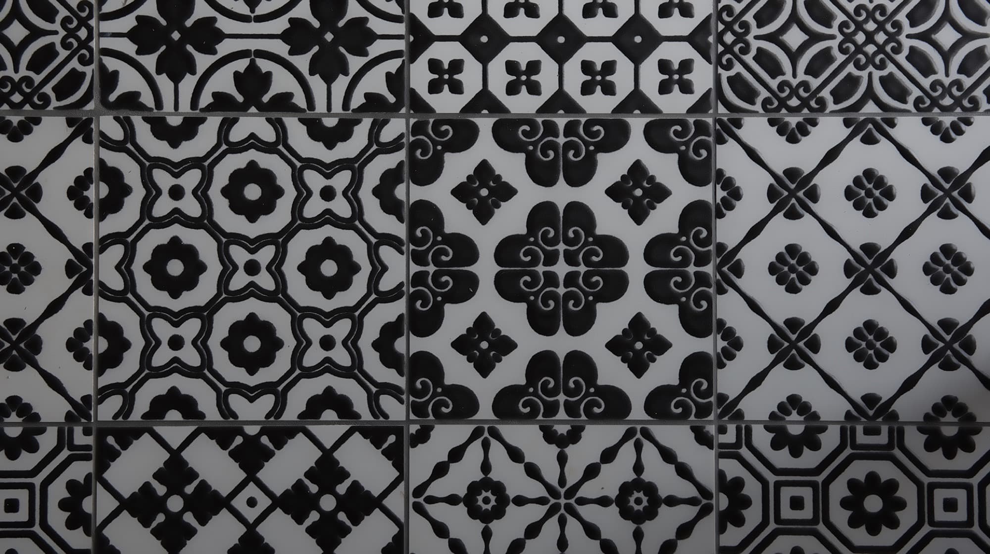 Black-and-white Italian tiles at the front door